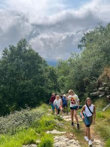 a group of people walking down a trail at San Sebastian Surf and Party Hostel in Aia
