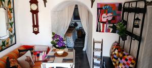 a living room with a couch and a table at Cueva La Loli in Guadix