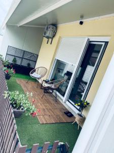 a patio with a table and chairs on a house at pappy home in Pasuljište