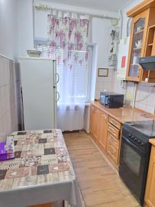 a kitchen with a counter top and a stove at Квартира Шевченка in Lutsk