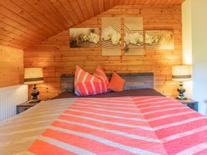 a bedroom with a large bed with two lamps at Wieshof in Kaltenbach