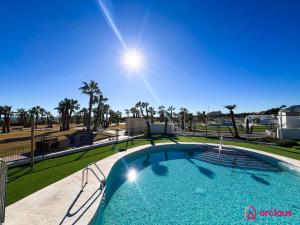 a swimming pool with a view of a golf course at El Privilegio in Cabanes