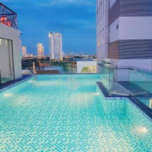a large swimming pool on the roof of a building at Louis Luxury Apartment & Hotel in Danang