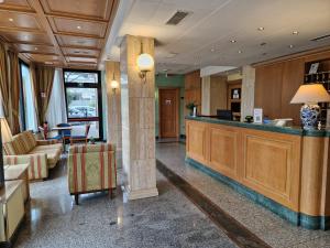 a lobby with a bar in a hotel at Hotel L'Aquila in Pomezia