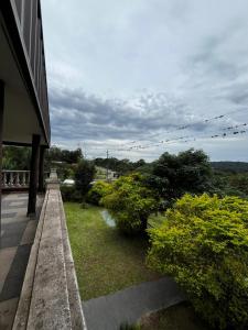 a balcony of a building with a view of a garden at casa cusi in Tafí Viejo