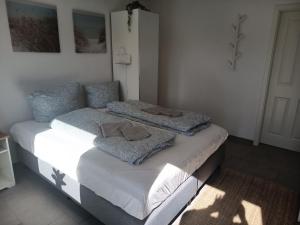 a bedroom with two beds with towels on them at Haus Lützowallee in Aurich