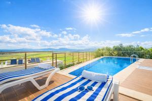 a villa with a swimming pool on a balcony at Villa Everest in Dalaman