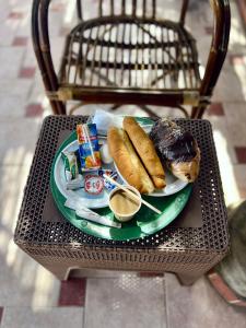 a green plate of food on a table at Kelany Palace Hotel Aswan in Aswan