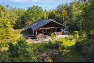 an aerial view of a log cabin in the woods at The Log Cabin in Hadsund