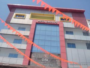 a building with orange tape in front of it at Hotel MEGA International Airport Zone in Hyderabad