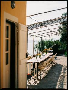 a long table with flowers on it on a patio at Casa Pernice in Lavagna