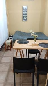 a living room with two tables and a couch at Lo de Lety in Baradero