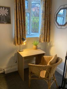a room with a desk and a chair and a window at 64 Carlton Street in Mansfield