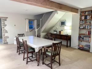 a dining room with a table and chairs at The Cart House in Helmsley
