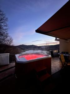 a hot tub sitting on top of a house at WołkoWilla - Willa z Jacuzzi na wyłączność MEGA WIDOK ! in Polańczyk