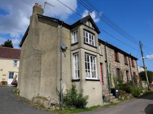 an old stone house on the side of a street at Scenery Cottage in Bridford +22 photos