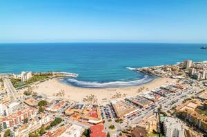 an aerial view of a beach and the ocean at Casa Tucan Javea, luxury close to Arenal Beach in Jávea