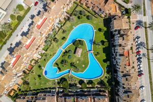 an aerial view of a pool in a resort at Casa Tucan Javea, luxury close to Arenal Beach in Jávea +65 photos