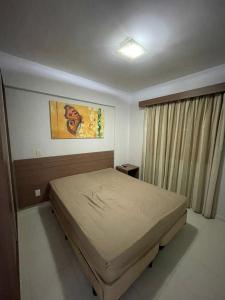 a bedroom with a large bed in a room at Flat Veredas Rio Quente-GO in Rio Quente +34 photos