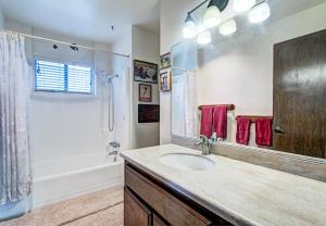 a bathroom with a sink and a shower at Catch some waves! Panoramic ocean views!- Cardiff Surfer in Cardiff-by-the-Sea +20 photos