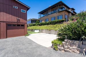 a driveway leading to a house with a garage at Catch some waves! Panoramic ocean views!- Cardiff Surfer in Cardiff-by-the-Sea