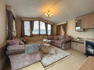 a living room with two couches and a table at Uk51366 - The Harley Davidson in Brechin