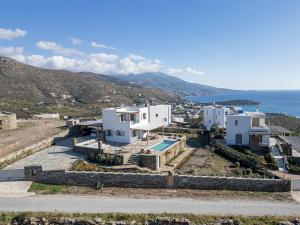 an aerial view of a villa with the ocean at West Side Pool House by Hostandros in Gavrio