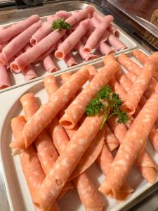 a tray of carrots sitting on a table at Sport hotel POMI in Harrachov