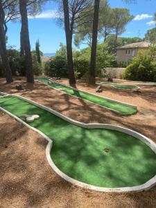 a fake golf course with a putting green at Studio Rez de jardin coté piscine - Clim in Saint-Raphaël +4 photos