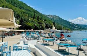 a group of tables and chairs on a beach at Trieste Sea Life in Trieste