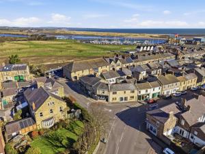 an aerial view of a town with houses at Just us Two - North East Escapes in Amble