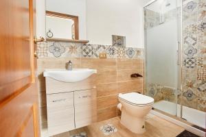 a bathroom with a toilet and a sink and a shower at A due passi dal Teatro Massimo in Palermo