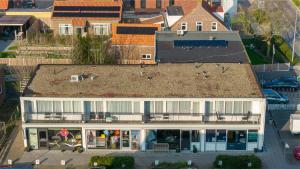 an overhead view of a large white house at Ooststraat 21 in Zoutelande +2 photos