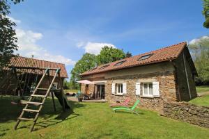 a small house with a ladder and a playground at Amboiras in La Croisille-sur-Briance