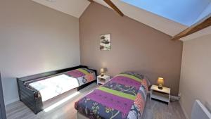 a bedroom with two beds and two lamps in it at Amboiras in La Croisille-sur-Briance +36 photos