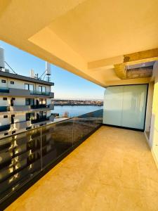 a balcony with a view of the water at B1 Apartments Deluxe in Năvodari