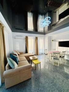 a living room with a couch and a table at B1 Apartments Deluxe in Năvodari