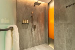 a shower with a glass door in a bathroom at Argyle Waifiden Hotel in Guangzhou +40 photos