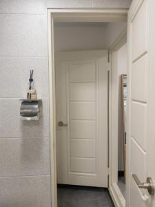 a white door in a room with at 더스테이365 스탠다드 in Seoul