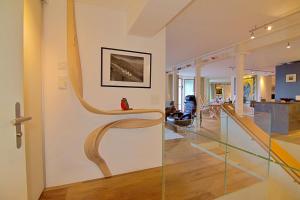 a room with a glass wall with a sculpture on it at Eiger Residence 2 in Wengen