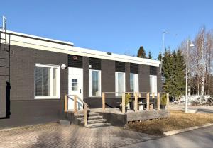 a building with a ramp in front of it at Casa de Fit in Joensuu +12 photos