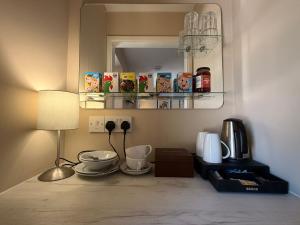 a corner of a room with a table with a lamp at The Red Lion Bed and Breakfast in Kings Walden