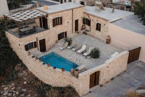 an aerial view of a house with a swimming pool at Vertigo Stone Villa - Roumeli Private Pool Escape in Roumelí