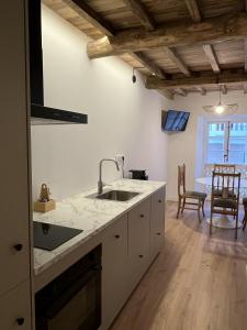 a kitchen with a sink and a counter top at Alcacer 4-1 in Puentedeume