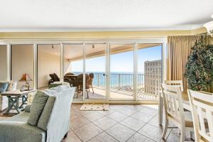 a living room with a view of the ocean at Relaxing Waterfront Condo with Pools & Gym Access in Destin