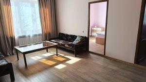 a living room with a couch and a mirror at Kutchak AparanQ in Kʼuchʼak