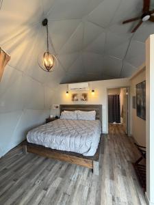 a bedroom with a large bed in a room at Bryce Glamp And Camp in Cannonville