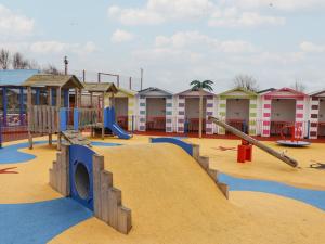 a playground with a slide and a slidesktop at Winchester - 244 in Rhyl