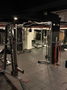 a room with a gym with many equipment at Beeza Clubhouse in Kottayam