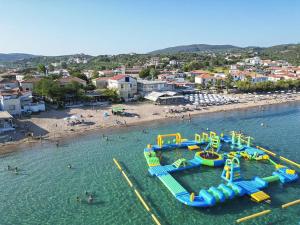an aerial view of a beach with a water slide at Avocado house in Finikounta +32 photos